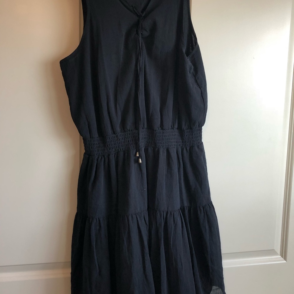 Black dress with black detailing on the dress